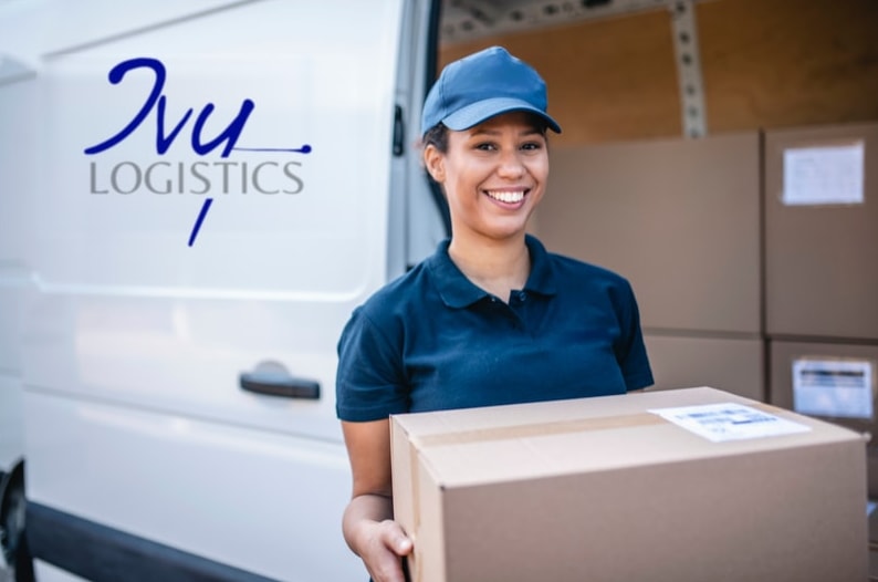 Ivy Logistics driver holding a package beside an Ivy van